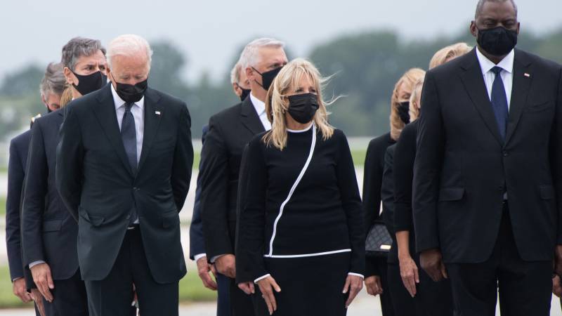 Biden in solemn ritual over remains of fallen US troops