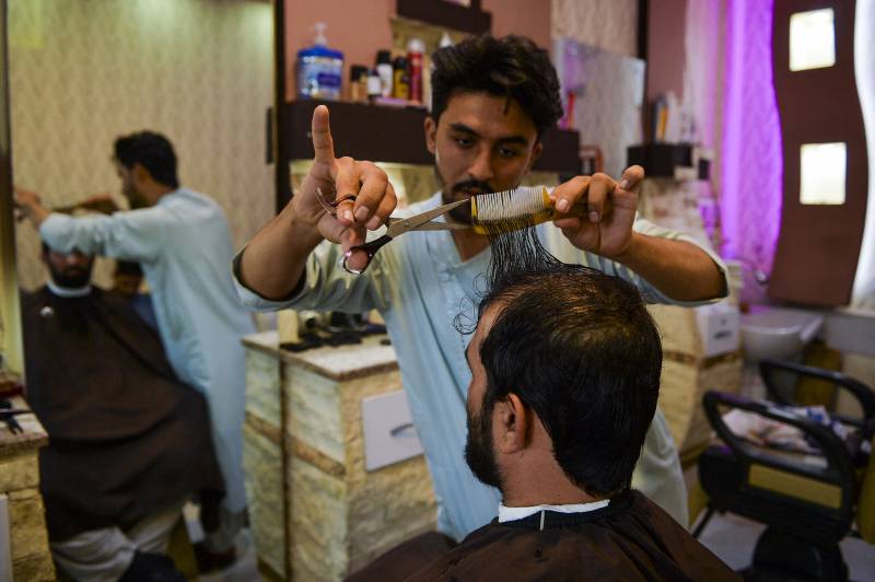 Barbers suffer under Taliban rule as Afghans shun fashion