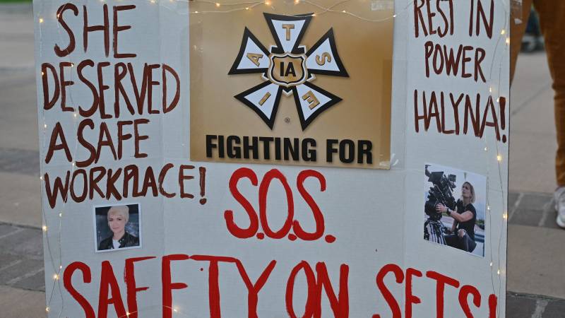 A sign calling for better safety on movie sets during a vigil held to honor cinematographer Halyna Hutchins at Albuquerque Civic Plaza in Albuquerque, New Mexico. AFP