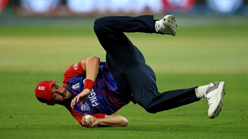 England's Chris Woakes takes the catch to dismiss Australia's Steven Smith. AFP