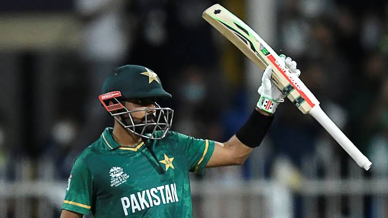 Pakistan's captain Babar Azam celebrates after scoring a half-century during against Scotland. AFP