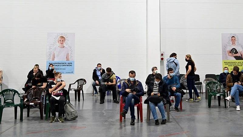 People wait to receive a dose of a vaccine against the coronavirus disease (Covid-19) in one of vaccination centers in the Ukrainian capital of Kiev 