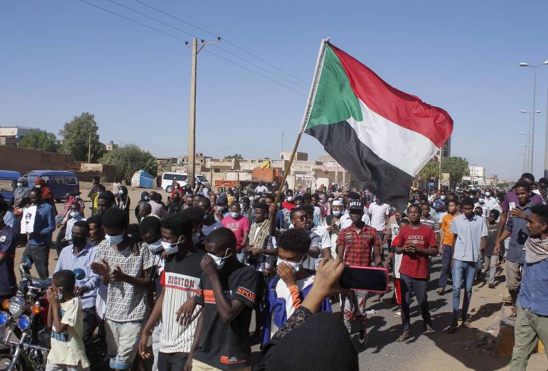 Sudan PM Hamdok reinstated after coup, protester killed