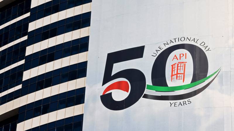 A banner celebrating the upcoming United Arab Emirates' 50th anniversary which falls on December 2, hangs on the side of a building in the Gulf emirate of Dubai. AFP