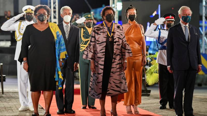 Prime Minister of Barbados Mia Mottley, former cricketer Garfield Sobers, President of Barbados, Dame Sandra Mason, Rihanna, and Prince Charles, Prince of Wales stand during the Presidential Inauguration Ceremony at Heroes Square in Bridgetown, Barbados. AFP