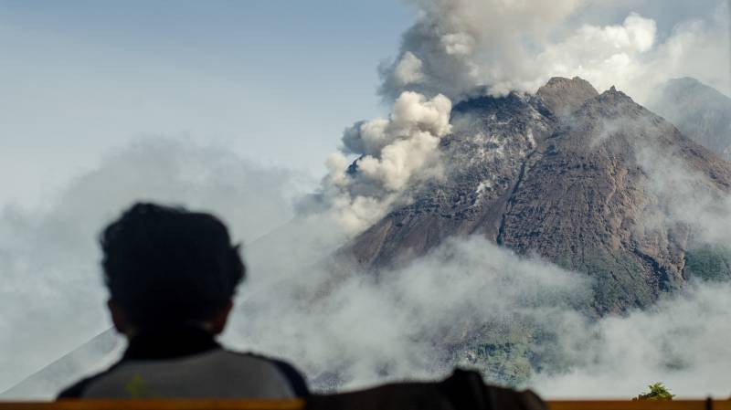 A villager looks at Mount Merapi, Indonesia's most active volcano