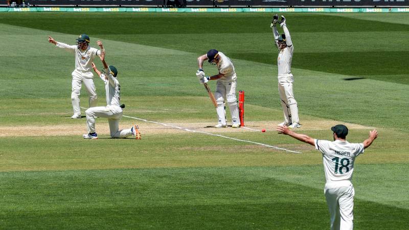 Australian players shout a leg-before-wicket appeal against England's batsman Ben Stokes (C) on the last day of the second Test of the Ashes series between Australia and England at Adelaide Oval. AFP