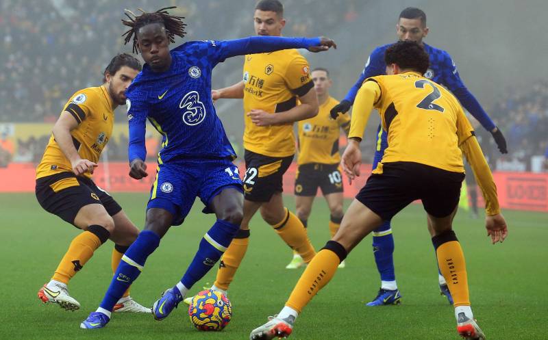 Chelsea's English defender Trevoh Chalobah (2L) comes under pressure during the English Premier League match between Wolverhampton Wanderers and Chelsea at the Molineux Stadium in Wolverhampton. AFP