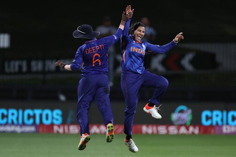 India's Sneh Rana (R) and Deepti Sharma celebrate the victory during the 2022 Women's Cricket World Cup match between West Indies and India at Seddon Park in Hamilton. AFP