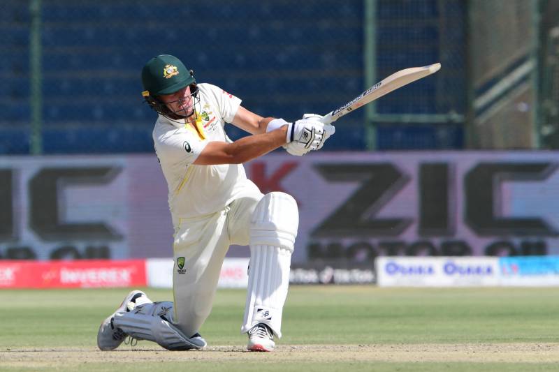 Australia's captain Pat Cummins plays a shot during the third day of the second Test cricket match between Pakistan and Australia at the National Cricket Stadium in Karachi on March 14, 2022. AFP