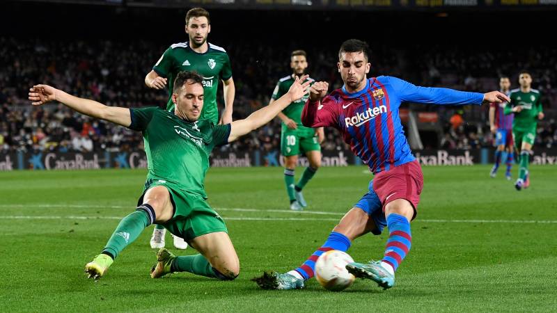 Osasuna's Spanish defender Unai Garcia (L) vies with Barcelona's Spanish forward Ferran Torres during their Spanish League match between FC Barcelona and CA Osasuna at the Camp Nou Stadium. AFP