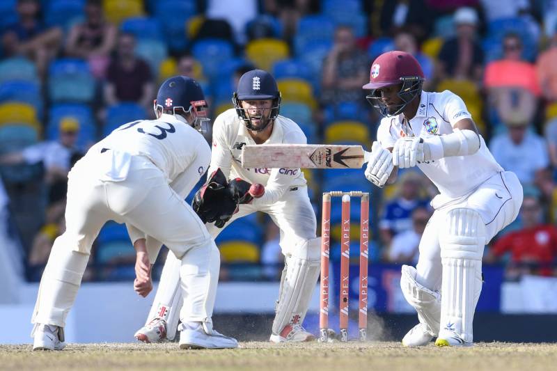 Kraigg Brathwaite (R) of West Indies hits 4 as Ben Foakes (C) of England watched during the 5th and final day of the 2nd Test between West Indies and England at Kensington Oval, Bridgetown, Barbados. AFP