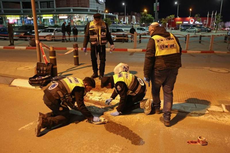 Four dead in Israel stabbing, car-ramming, assailant shot