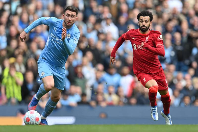 Liverpool's Egyptian midfielder Mohamed Salah (R) vies with Manchester City's French defender Aymeric Laporte. AFP