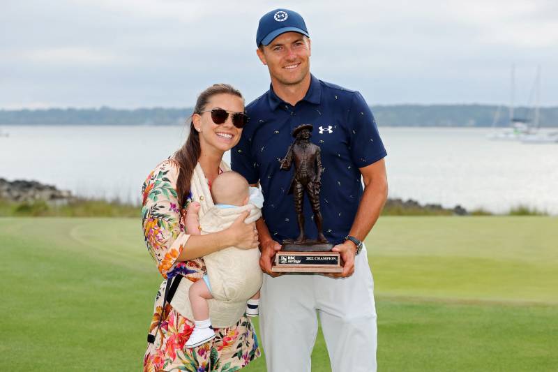 Jordan Spieth poses with the trophy with wife Annie Verret and son Sammy Spieth after winning the RBC Heritage in a playoff at Harbor Town Golf Links. AFP