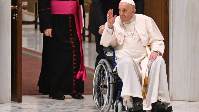 Pope Francis arrives on wheelchair during the audience to the Participants to Plenary Assembly of the International Union of Superiors General in the Paul VI hall at the Vatican. AFP