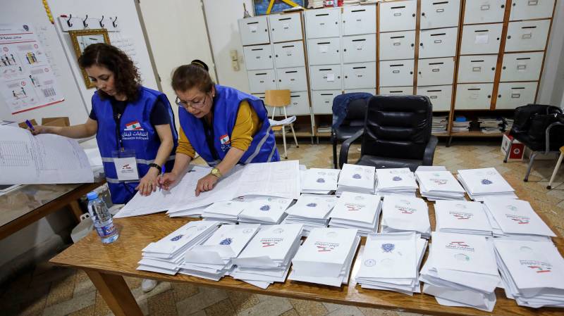 Lebanese electoral staff start counting votes for parliamentary elections at a polling station in the northern coastal city of Batroun. AFP