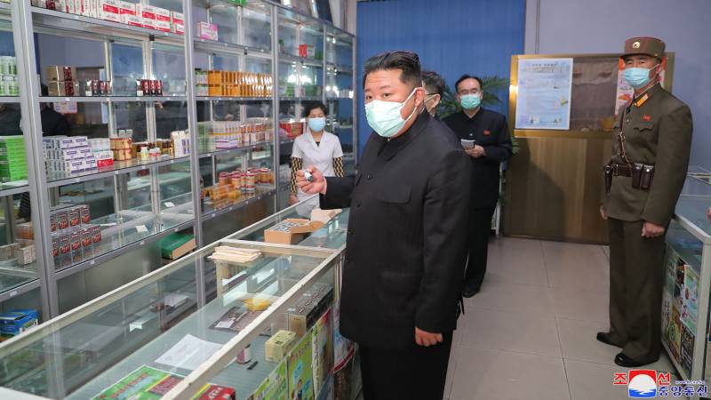 North Korean leader Kim Jong Un (C) inspects a pharmacy in Pyongyang. AFP