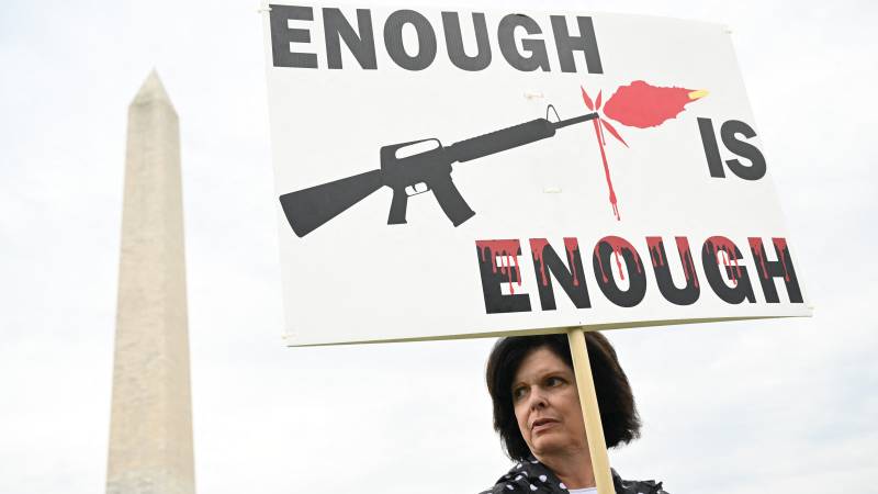 In this file photo taken on June 11, 2022 gun control advocates participate in the 