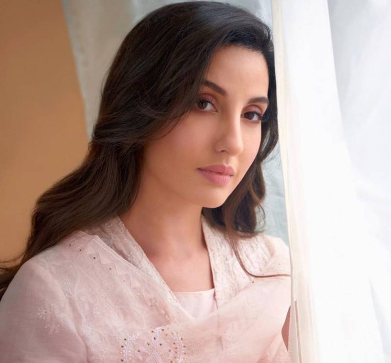 Nora Fatehi drops bomb on internet in orange attire