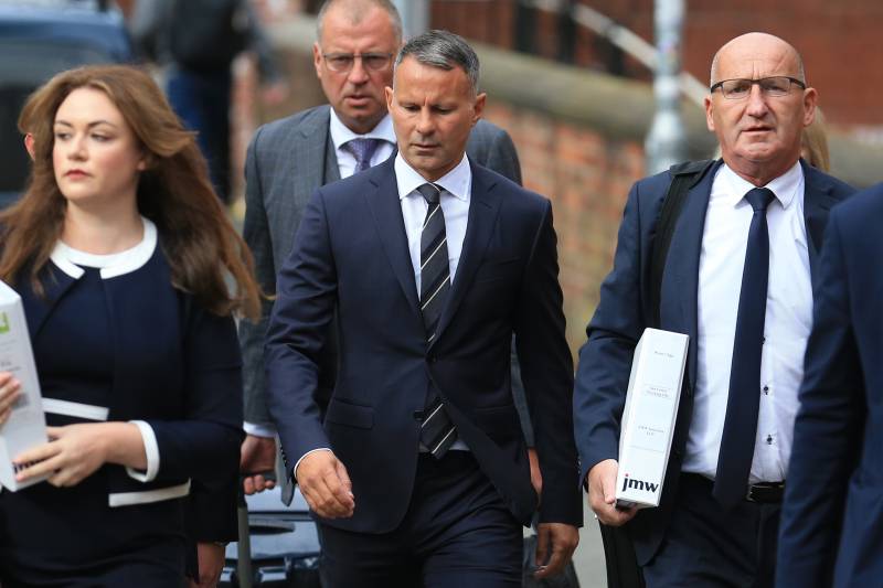 Former Manchester United star and Wales manager Ryan Giggs (C) arrives with his legal team at Manchester Minshull Street Crown Court in Manchester. AFP