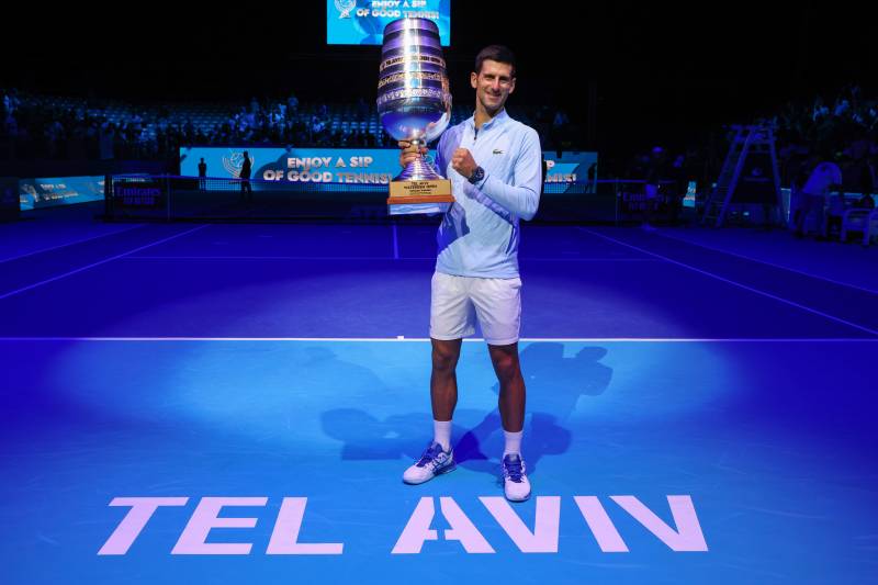 Serbia\'s Novak Djokovic poses with the trophy after winning the men\'s singles final tennis match at the Tel Aviv Watergen Open 2022 in Israel. AFP