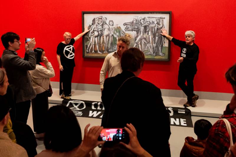 Protesters glue hands to cover of Picasso painting