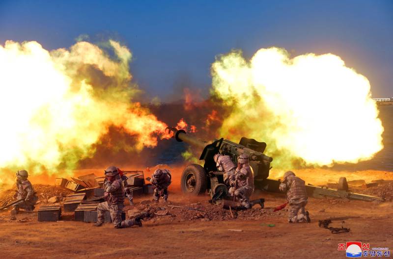 This picture taken on October 6, 2022 and released from North Korea's official Korean Central News Agency (KCNA) on October 10, 2022 shows the North Korean People's Army front-line long-range artillery division and air force squadron during a fire attack training exercise, at an undisclosed location. AFP