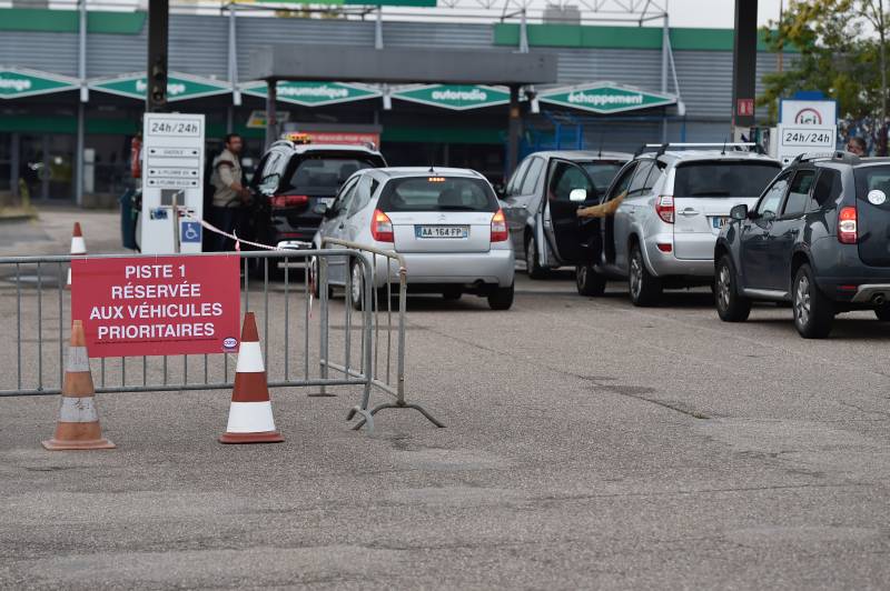 A priority lane is installed in a gas station in Mondelange, northeastern France, on October 13, 2022, as filling stations across France are low on petrol as a pay-related strike by workers at energy giant TotalEnergies entered its third week despite government pressure to negotiate. AFP