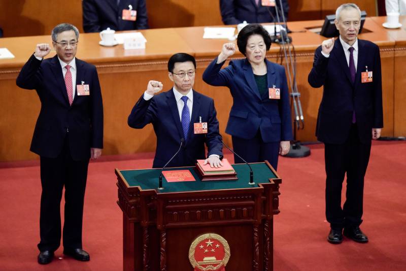 This file photo taken on March 19, 2018 shows China's newly elected Vice Premier Sun Chunlan (2nd R) taking an oath after being elected during the seventh plenary session of the first session of the 13th National People's Congress (NPC) at the Great Hall of the People in Beijing. AFP