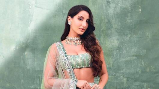 Nora Fatehi dazzles in blush green Lehenga