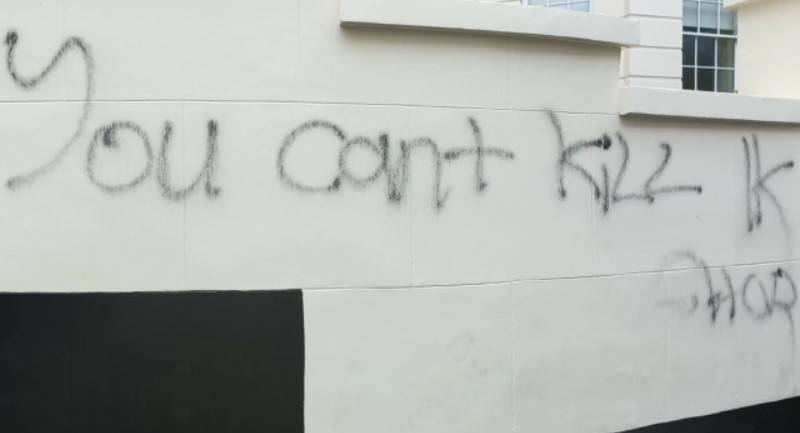 “You cannot kill Khan” wall chalked on Hussain Nazwaz office walls