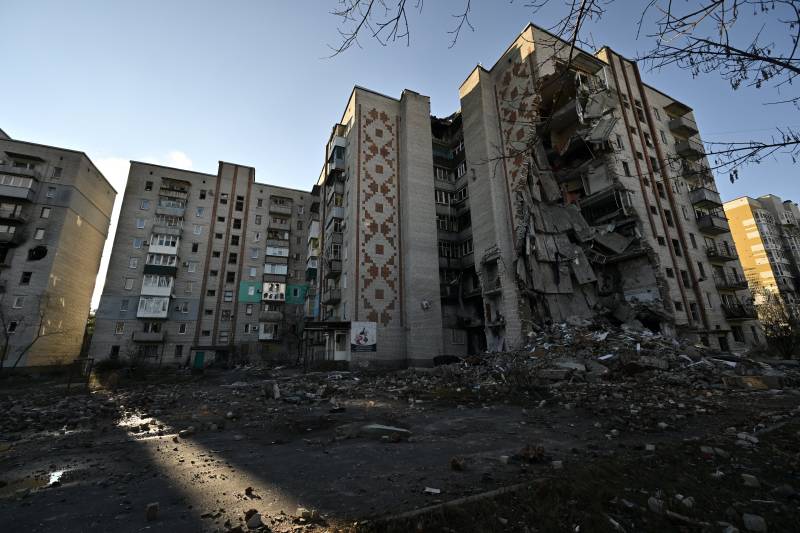 A photograph shows heavily damaged residential buildings following attacks in the town of Lyman, Donetsk region, amid the Russian invasion of Ukraine. AFP