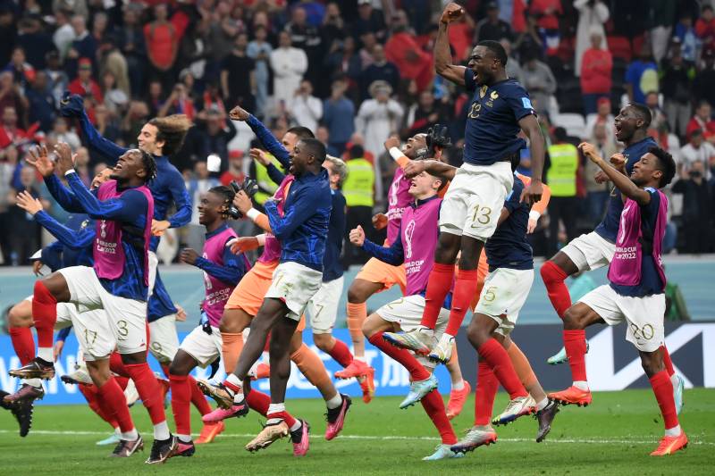 France's players celebrate their victory in the Qatar 2022 World Cup semi-final football match between France and Morocco. AFP