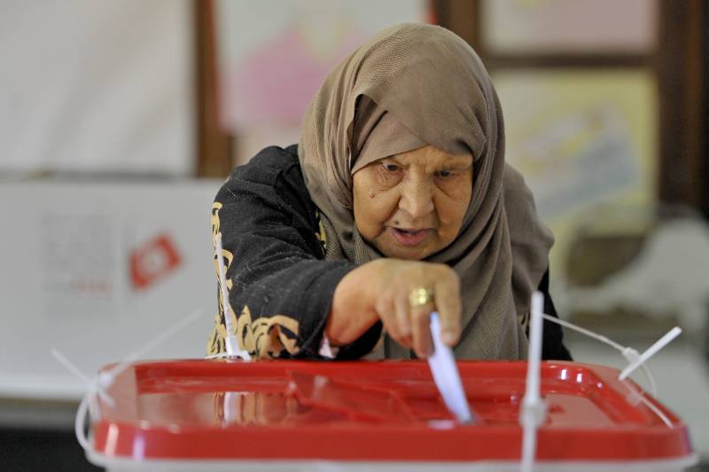 A Tunisian voter casts her ballot at a polling station in Ben Arous region near Tunis. AFP