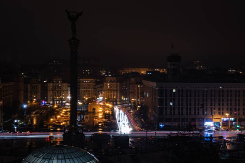 This photograph taken with a long exposure shows car lights near the Maidan square during a power cut in the city of Kyiv, amid the Russian invasion of Ukraine. AFP