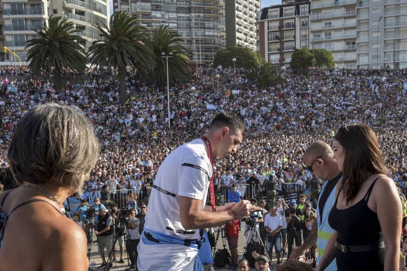 Argentine goalkeeper Emiliano Martinez signs an autograph during a tribute in Mar del Plata, Argentina, upon his return to his hometown after winning the Qatar 2022 World Cup tournament. AFP