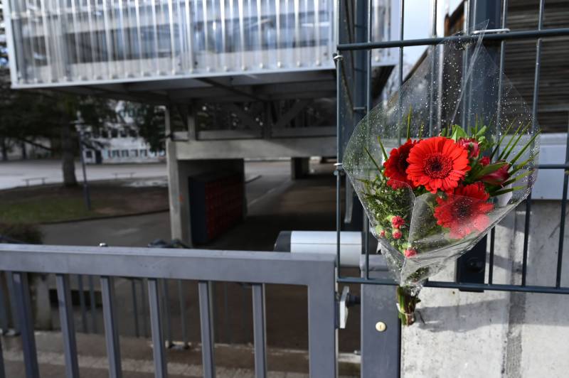 A bouquet of flowers attached at the main entrance of the Louis Armand secondary school in Golbey, eastern France, where was schooled Lucas, a 13-year-old boy who committed suicide. AFP