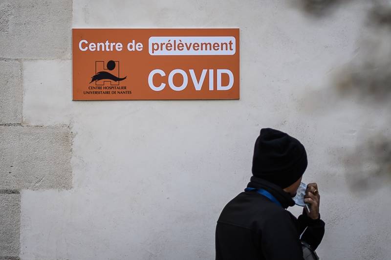 A man passes in front of a Covid 19 laboratory at the Saint-Jacques CHU (Centre Hospitalier Universitaire) in Nantes, western France. AFP