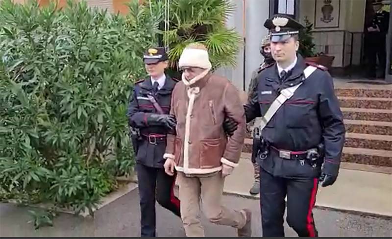 This handout video grab taken and released by the Italian Carabinieri Press Office on January 16, 2023 shows the arrest by Carabinieri of the Italy's top wanted mafia boss, Matteo Messina Denaro in Palermo, in his native Sicily after 30 years on the run. AFP