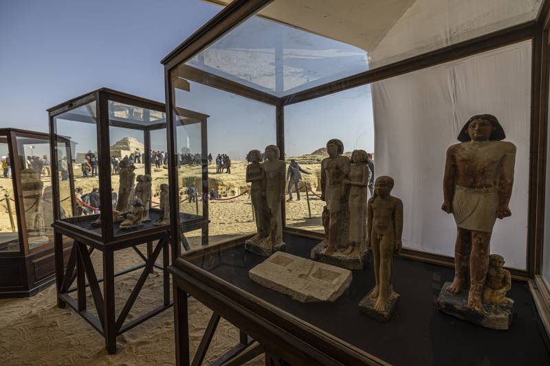 A collection of pharaoh statues is on display during a press conference at the Saqqara necropolis, where a gold-laced mummy and four tombs including of an ancient king's 