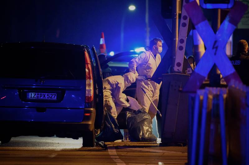 Forensic staff of the police secures evidence at the train station in Brokstedt, northern Germany. AFP