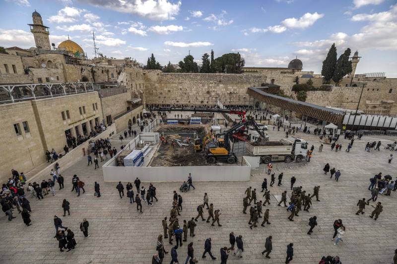 This file photo taken on January 15, 2023 shows a view of construction works conducted by the Western Wall Heritage Foundation to build an underground floor at the Plaza of the Western Wall (C) in the Old City of Jerusalem, with the Al-Aqsa Mosque complex seen in the background. At Jerusalem's Western Wall plaza, a recent excavation has alarmed some heritage specialists who fear the traces of the centuries-old al-Mughrabi Arab neighbourhood, or Moroccan quarter, razed by Israel may disappear. AFP