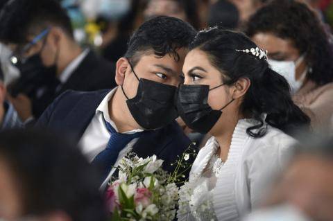 Hundreds of couples wed in a mass ceremony on Valentine\'s Day in one of the last Mexican states to legalize same-sex marriage