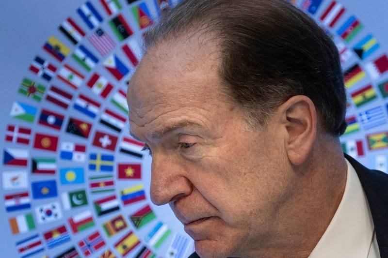 World Bank chief David Malpass announced he would step down nearly a year early, ending a tenure at the head of the development