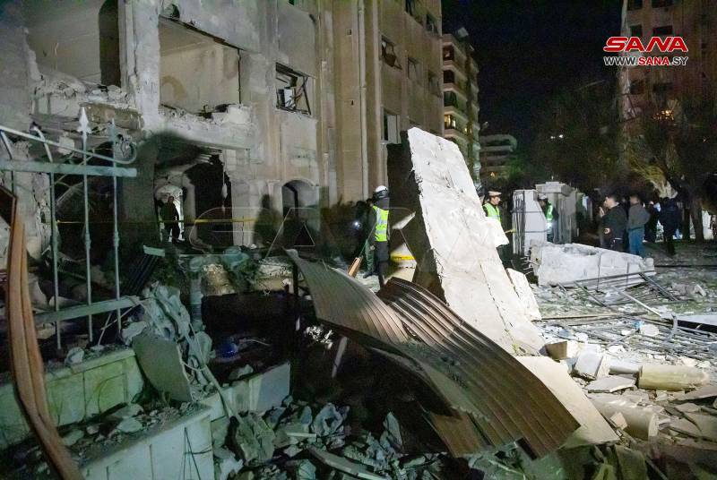 A handout picture taken and released on Sunday by the official Syrian Arab News Agency (SANA) shows a damaged building following an Israeli missile strike where 15 people were killed in Damascus. AFP 