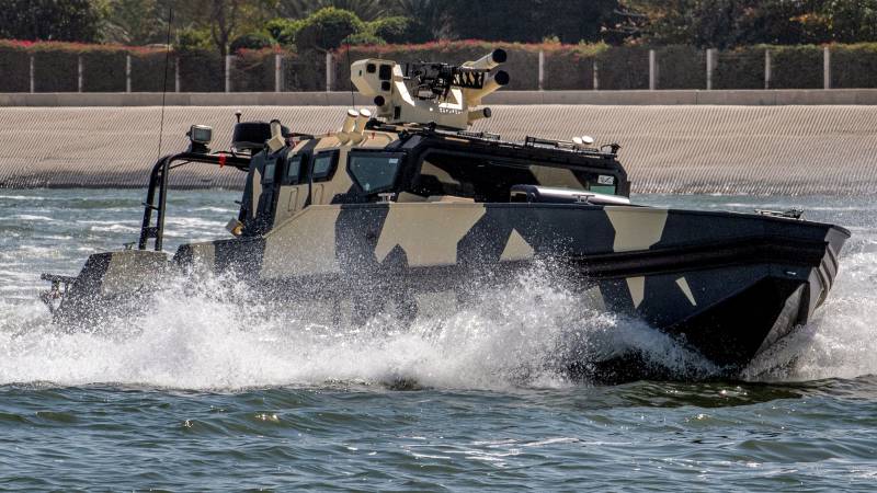 A Chaser multi-purpose combat boat performs maneuvers during a demonstration at the Naval Defence and Maritime Security Exhibition (NAVDEX), part of the wider International Defence Exhibtion (IDEX) at the Abu Dhabi International Exhibition Centre