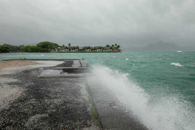 Waves are seen crashing on the Pointe Jeome jetty in Mahebourg, Mauritius, as Cyclone Freddy approaches. AFP