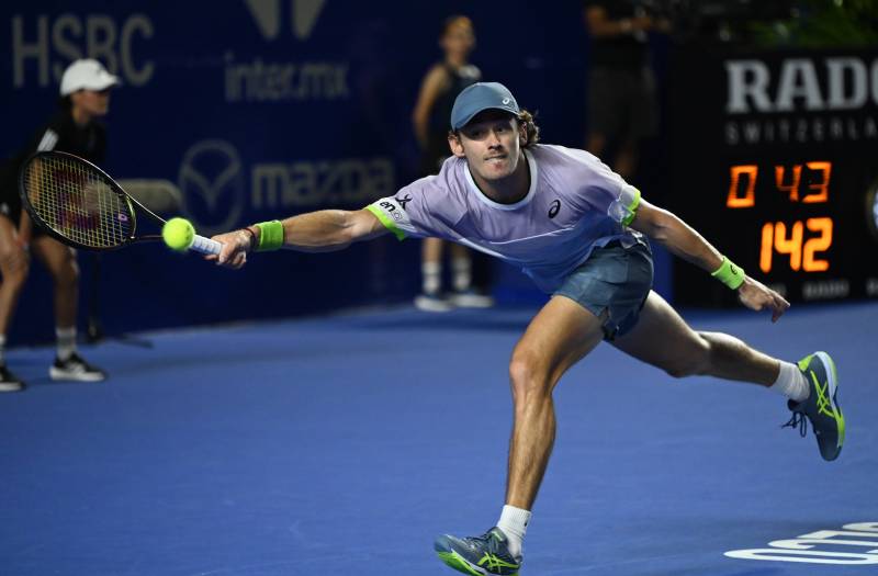 Australia's Alex De Minaur returns the ball against Denmark's Holger Rune during semifinals of the Mexico ATP Open 500 men's singles tennis match at the Arena GNP, in Acapulco, Mexico, on March 4, 2023. AFP