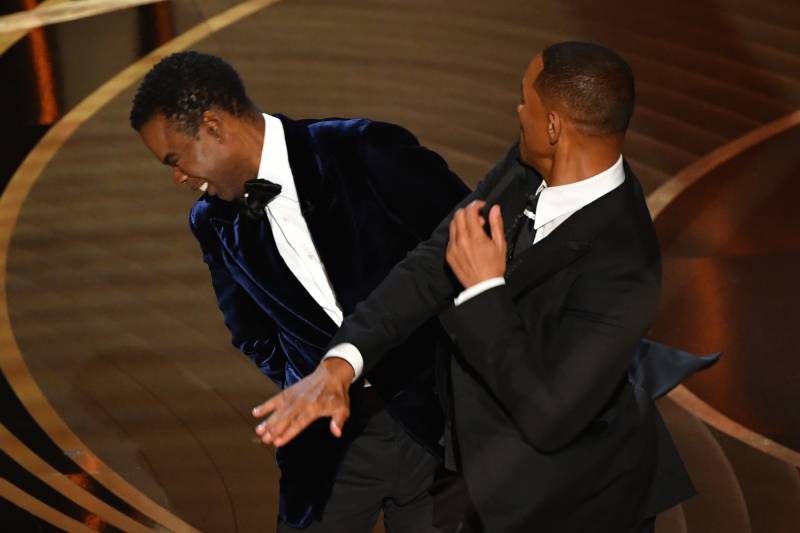 In this file photo taken on March 27, 2022 US actor Will Smith (R) slaps US actor Chris Rock onstage during the 94th Oscars at the Dolby Theatre in Hollywood, California. Chris Rock finally hit back at Will Smith on March 4, 2023 in a brutal stand-up routine, a year after the actor slapped him in front of a global TV audience for the Oscars. AFP 